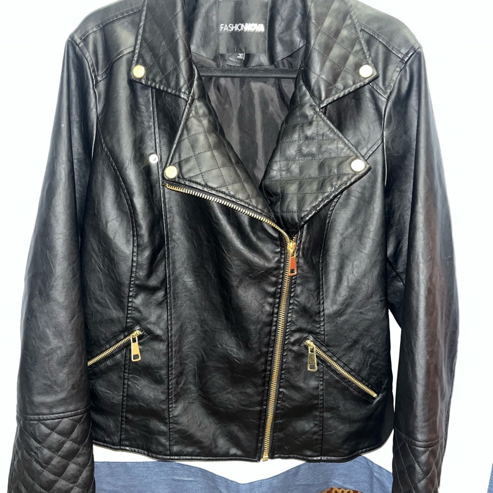 Fashion Nova Black Leather Biker Jacket with gold accents.